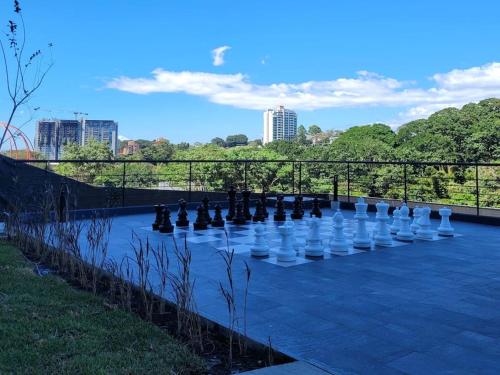 a giant chess set on a blue at Nucleo 514 in San José