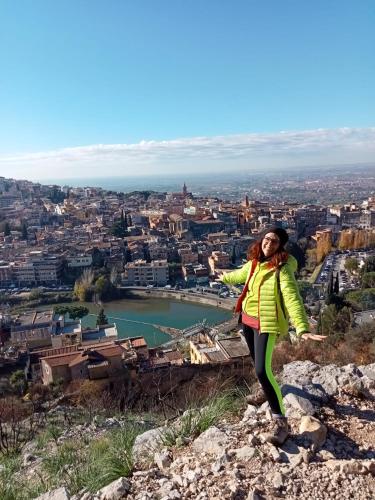 a woman standing on top of a mountain at Vecchio Treno guest house in Tivoli