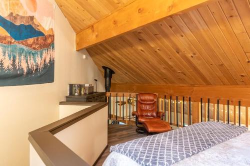 a bedroom with a bed and a wooden ceiling at Escape to Ptarmigan Village 47 in Whitefish
