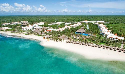 an aerial view of a resort on the beach at El Dorado Royale Catamarán, Cenote & More Inclusive in Puerto Morelos