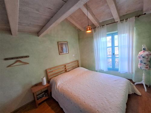 Tempat tidur dalam kamar di Apartment Sartoria