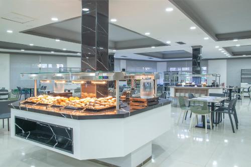 a bakery with a display of pastries on a counter at Pierre & Vacances Apartamentos Benidorm Horizon in Benidorm