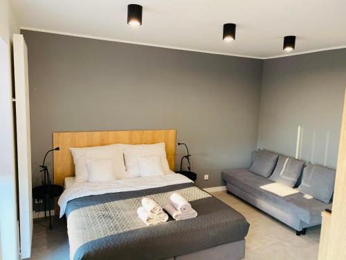 Una cama o camas en una habitación de Apartament Nowy Verdon Ruda Śląska