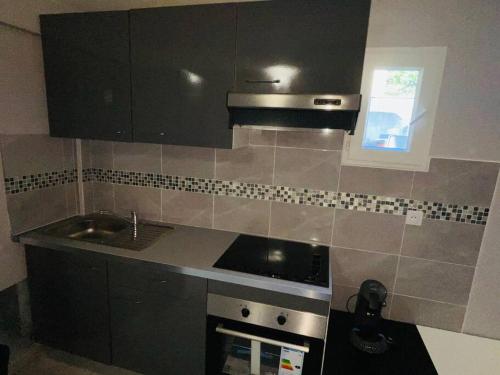 Dapur atau dapur kecil di Petit paradis pour 2 personnes