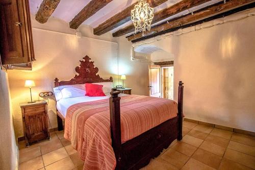 a bedroom with a large bed in a room at Catalunya Casas Country Chateau for 22 persons - close to Sitges! in Les Masuques