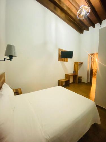 Cama o camas de una habitación en Palacio de las Rosas