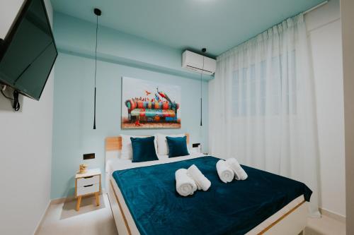 En eller flere senge i et værelse på Azuro Luxury Living