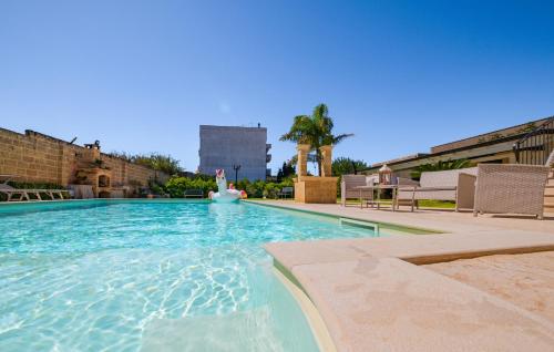 a swimming pool with a person in a ball in the water at Casa D'Amore con Piscina Privata in Alessano