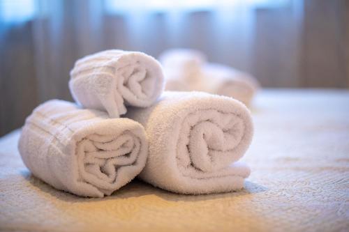 a stack of towels sitting on a table at Hotel Ristorante Sagittario in Feltre