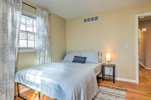 a bedroom with a large bed and a window at Cincinnati Vacation Rental 5 Mi to Downtown! in Cincinnati