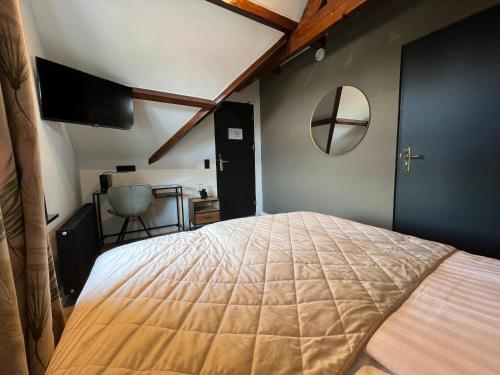 a bedroom with a large bed in a room at Boutique Hotel de Kade Zaandam-Amsterdam in Zaandam