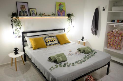 a bedroom with a bed with pillows on it at Villa Settimia a 50 mt dalla spiaggia! in Àrbatax