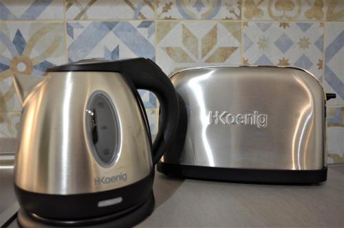 two toasters sitting next to each other on a counter at Villa Settimia a 50 mt dalla spiaggia! in Àrbatax