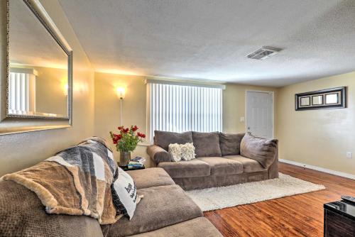 a living room with a couch and a table at Family Home with Lanai and Yard in Port Richey! in Port Richey
