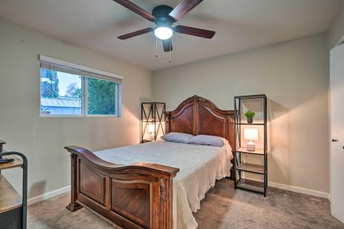 a bedroom with a bed with a ceiling fan at Mesa Home with Outdoor Pool - 2 Mi to Sloan Park! in Mesa