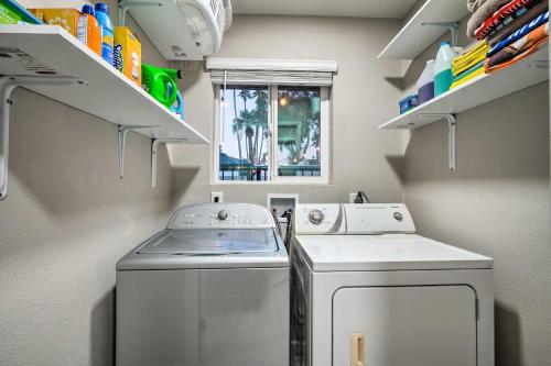 a small laundry room with a washer and dryer at Mesa Home with Outdoor Pool - 2 Mi to Sloan Park! in Mesa