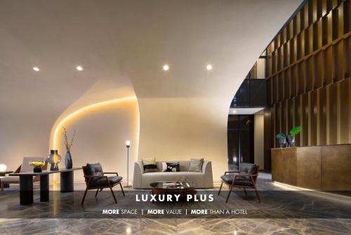 a lobby with a couch and chairs and a table at Xoma - Luxury Plus by Viadora in Mexico City
