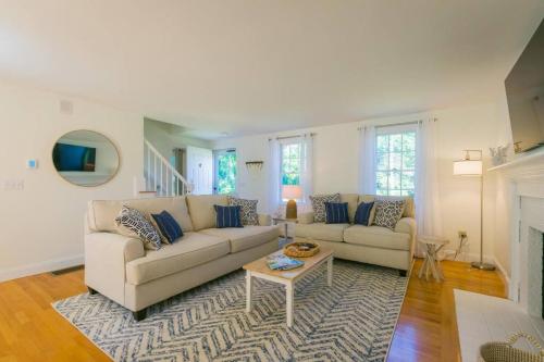 a living room with a couch and a coffee table at 56Beachway-Private beach Refreshed in 2022 Cozy in East Sandwich