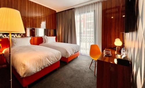 Säng eller sängar i ett rum på Boutique Hotel Gauthier Restaurant Terrasse