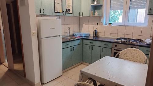 Kuchyň nebo kuchyňský kout v ubytování Apartman Dragicevic