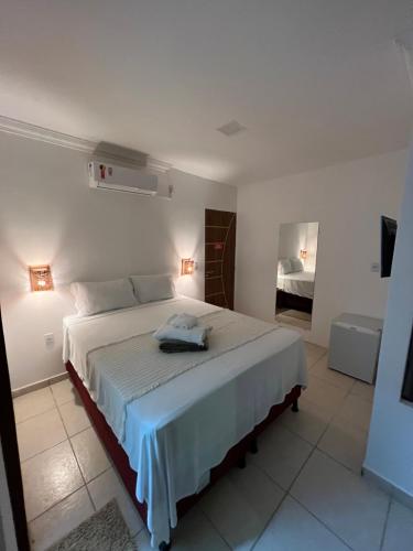 Cama o camas de una habitación en Maré Suítes Maragogi