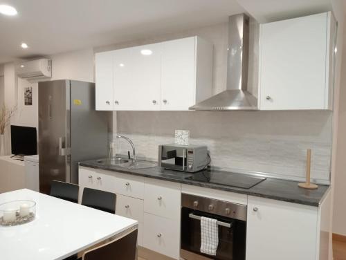 Kuchyňa alebo kuchynka v ubytovaní Manrique Rooms