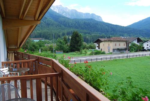a balcony with a view of a field and mountains at B&B Nido Delle Aquile in Monclassico