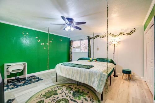 a bedroom with a swing bed and a green wall at 'Urban Green Living' in Houston