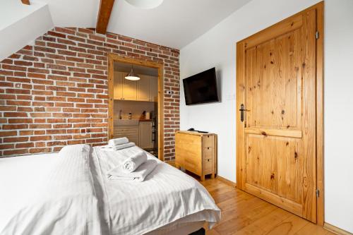 Cama ou camas em um quarto em Blick Apartments - Riverview Studio Apartment