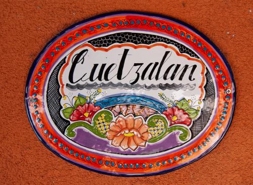 a plate with the words old salami on a wall at Posada Mariana Bed and Breakfast in Catheys Valley