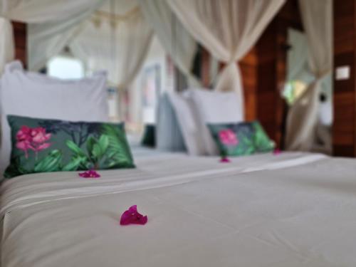 Hotel Le Manguierにあるベッド