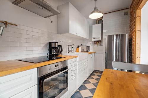 Kuchyň nebo kuchyňský kout v ubytování Blick Apartments - Riverview Studio Apartment