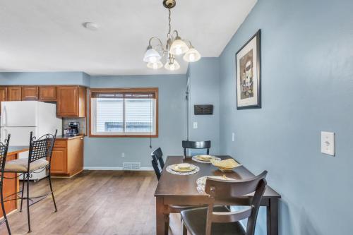 a kitchen and dining room with a table and chairs at Lovely PET FRIENDLY three bedroom in desirable Urbandale Location! home in Wyoming