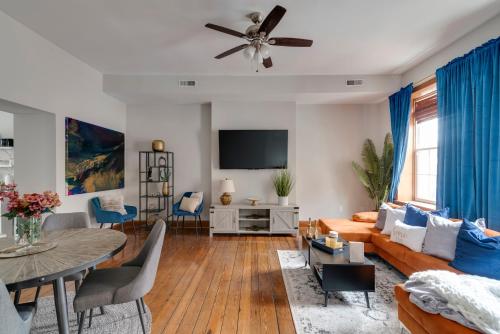 a living room with a couch and a table at Cozy Historic Family Home in the Heart of Richmond in Richmond