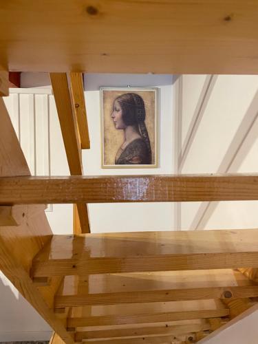 a picture of a woman in a painting on a ceiling at Apartmány Modrý Dom in Podhájska