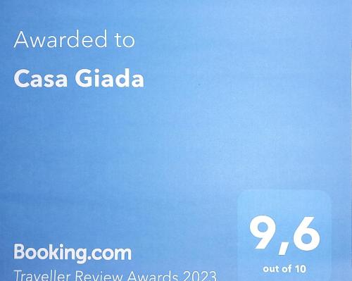 Et logo, certifikat, skilt eller en pris der bliver vist frem på Casa Giada