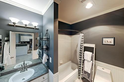 a bathroom with a sink and a bath tub at Cityscape Dreams in Seattle