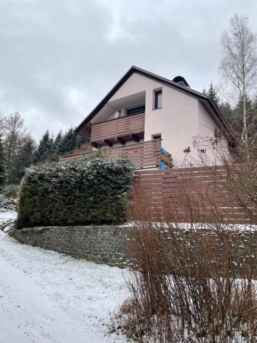 a house on the side of a snow covered road at Chata u lesa in Bezděkov