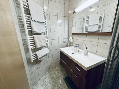a bathroom with a sink and a mirror at Ferienwohnung Steinernes Meer in Maria Alm am Steinernen Meer