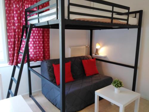 Ένα ή περισσότερα κρεβάτια σε δωμάτιο στο Le Petit Aurouze