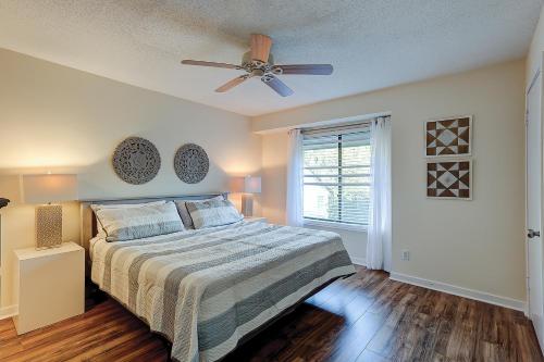 a bedroom with a bed and a ceiling fan at Springwood Villas 21 in Hilton Head Island