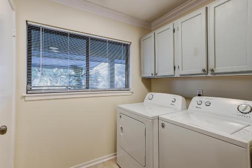 a white laundry room with a washer and dryer at Springwood Villas 21 in Hilton Head Island