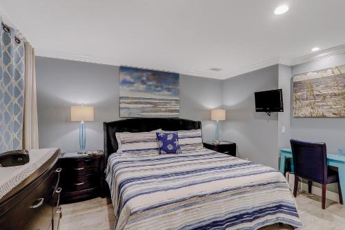 a bedroom with a bed and a desk and a sink at HH Beach & Tennis 226C in Hilton Head Island