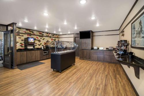 a large room with a counter and a kitchen at Best Western Golden Spike Inn & Suites in Hill City