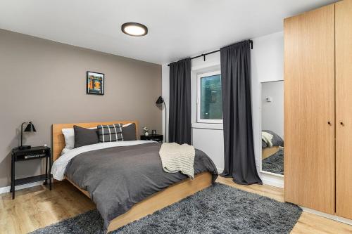 a bedroom with a bed and a window at The Maple House in Seattle