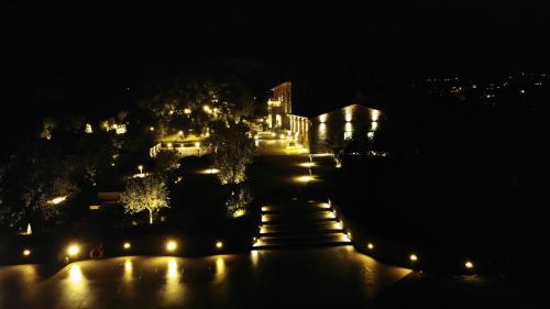 a view of a city at night with lights at Villa Paladini in Montefiascone