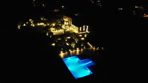 an overhead view of a pool at night at Villa Paladini in Montefiascone