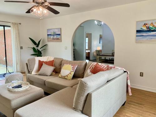a living room with a couch and a ceiling fan at New! Close To Beach, Cozy, New beds & Family Friendly in Navarre