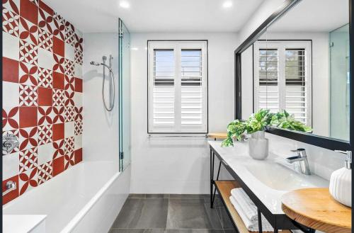 a bathroom with a sink and a glass shower at The Diggs in Anglesea