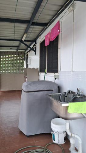 a bathroom with a sink and a tub and a toilet at Mead Road Homestay Tours & Transfers Studio Flat 2 in Suva